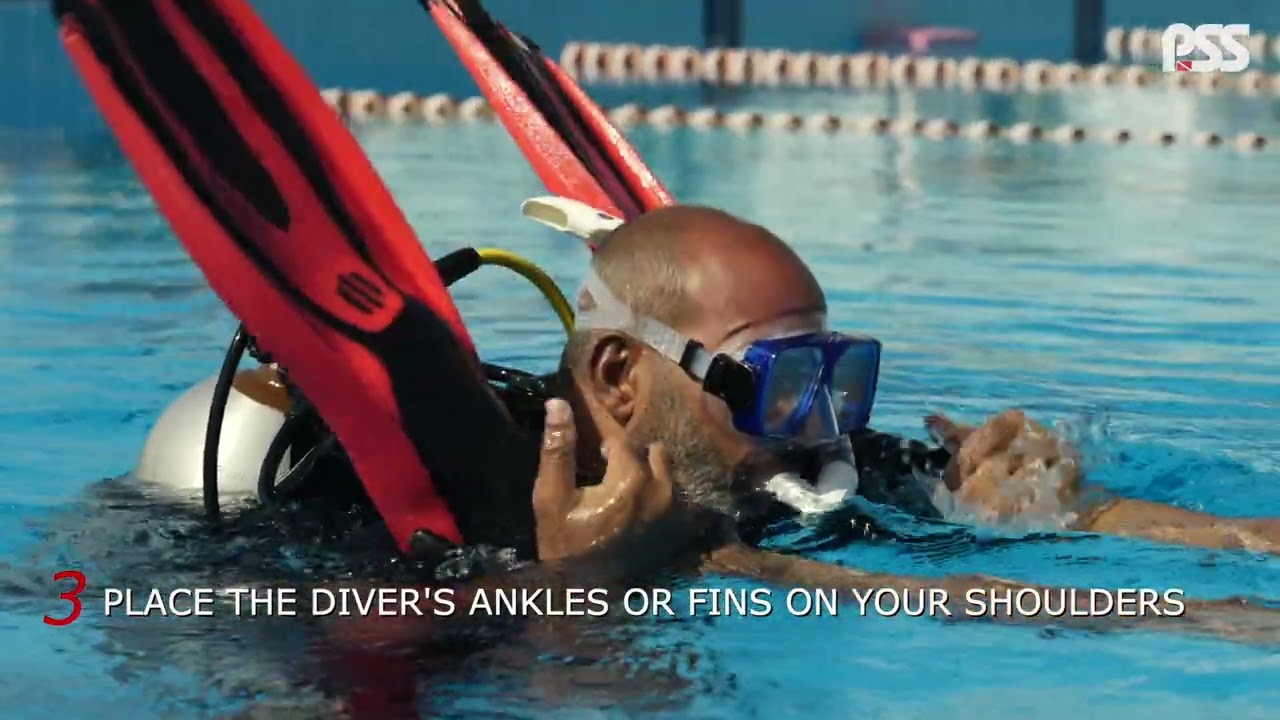 TRANSPORTING ANOTHER DIVER ON THE SURFACE