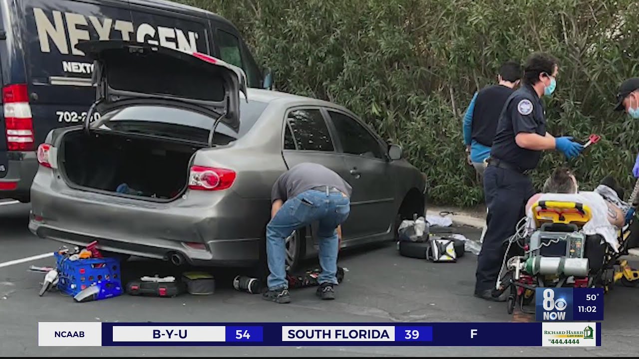 Republic Services employees lift car pinned on top of man