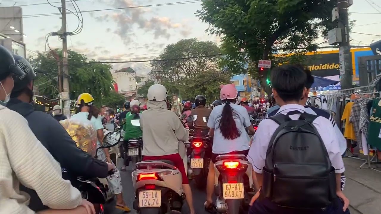 Vietnam in the afternoon has wide open spaces, and the scene is one of rush hour traffic jams.