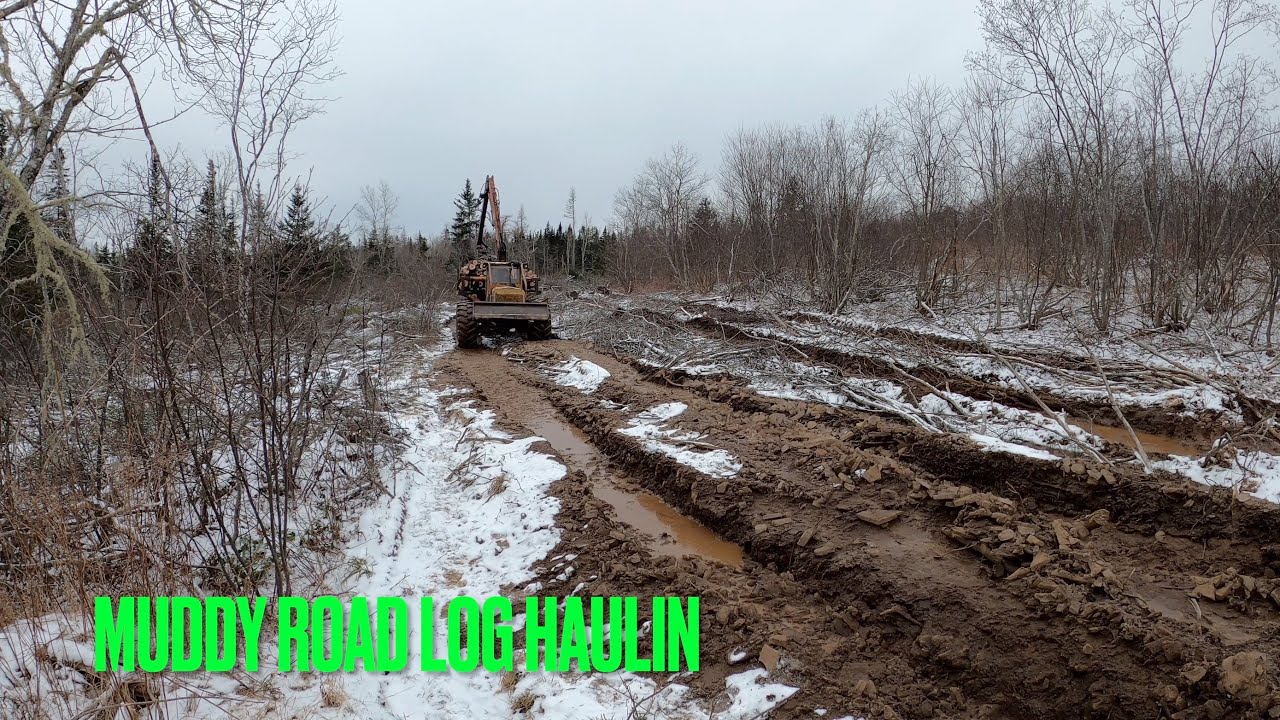 1976 John Deere Tree Farmer Porter Hauling Hardwood Logs out Muddy Road!! Old Forestry Equipment!