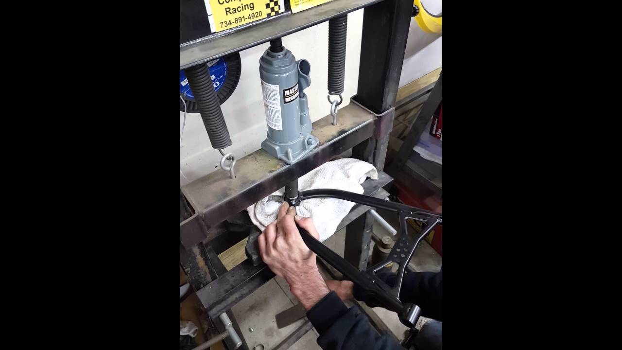 Snowmobile repairs upper control arm