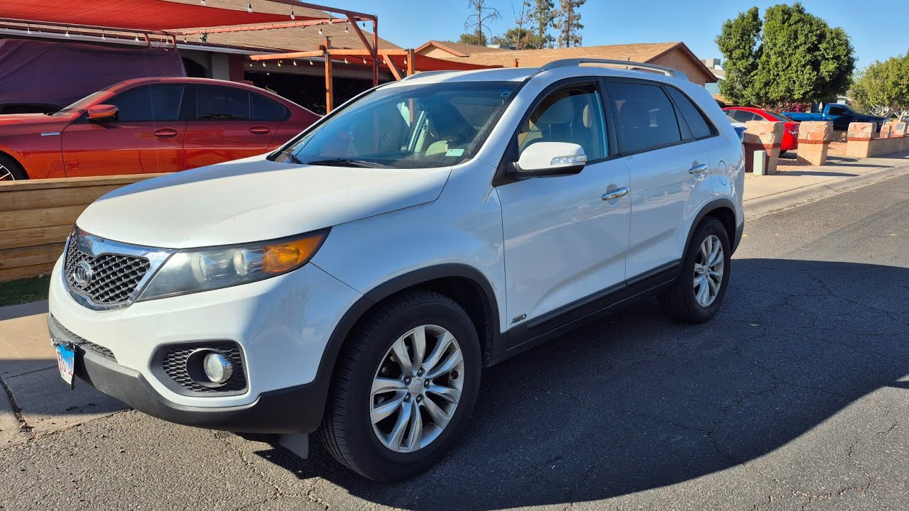Замена трансмиссионной жидкости и термостата Kia Sorento 2011 года