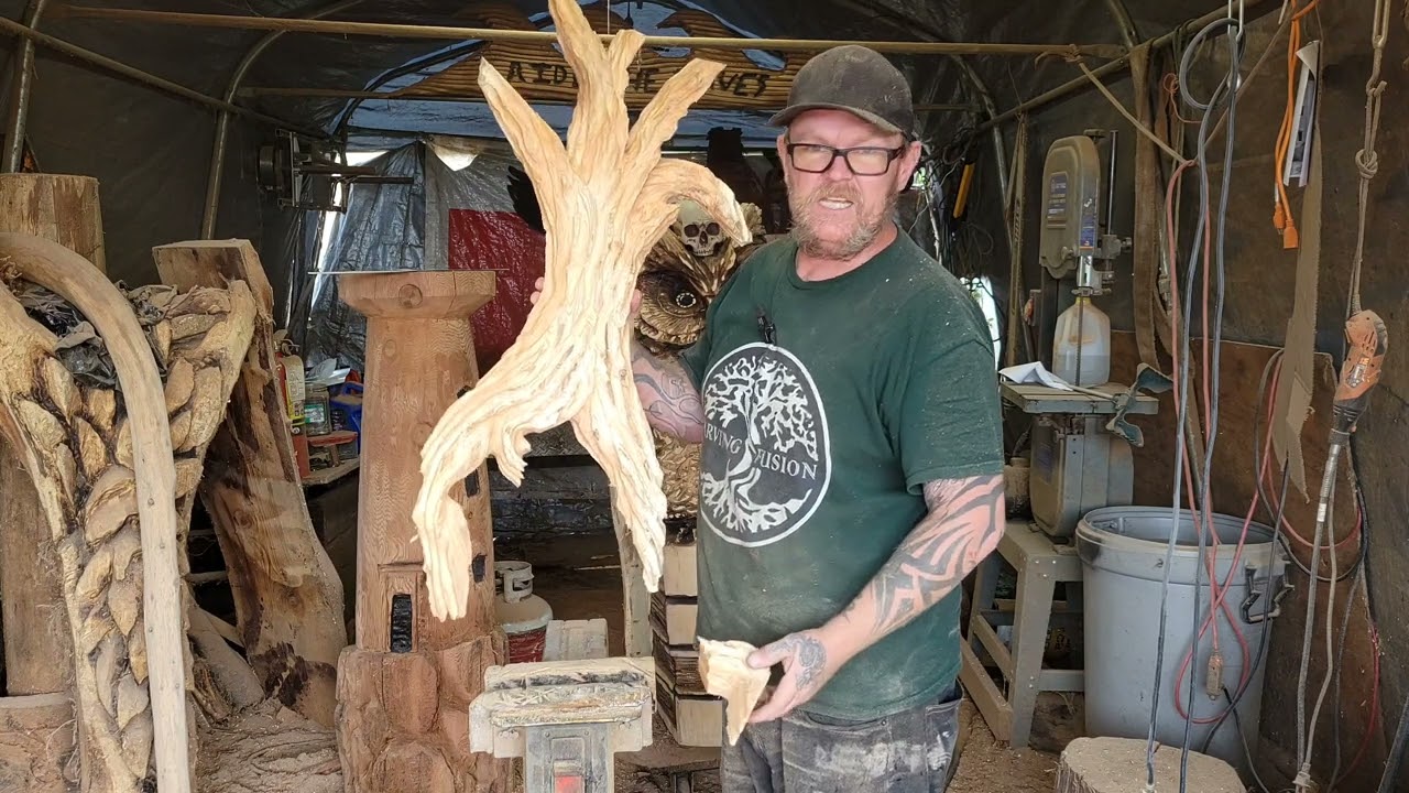 Chainsaw carving a Shou Sugi Ban tree.