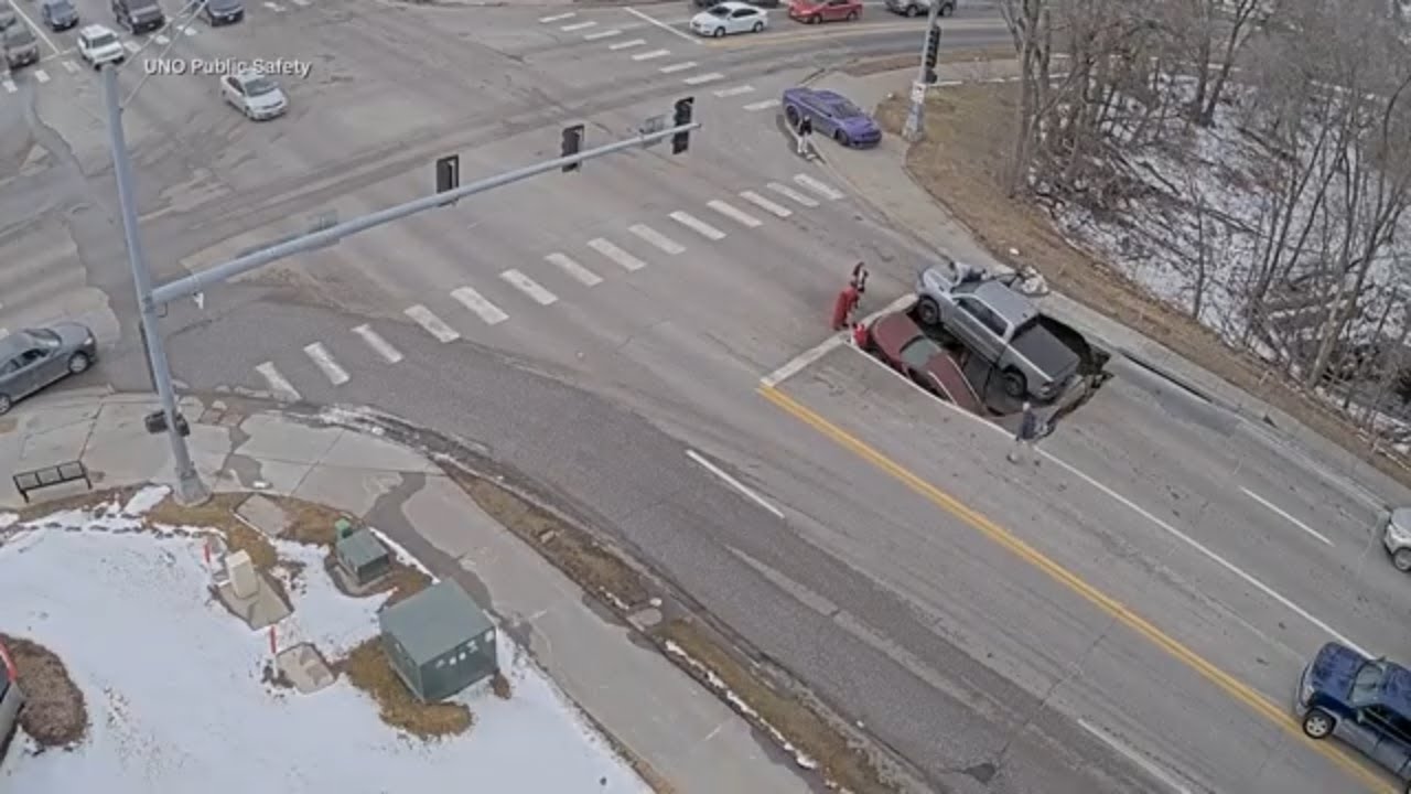 ON CAM: Sinkhole swallows vehicles in Omaha