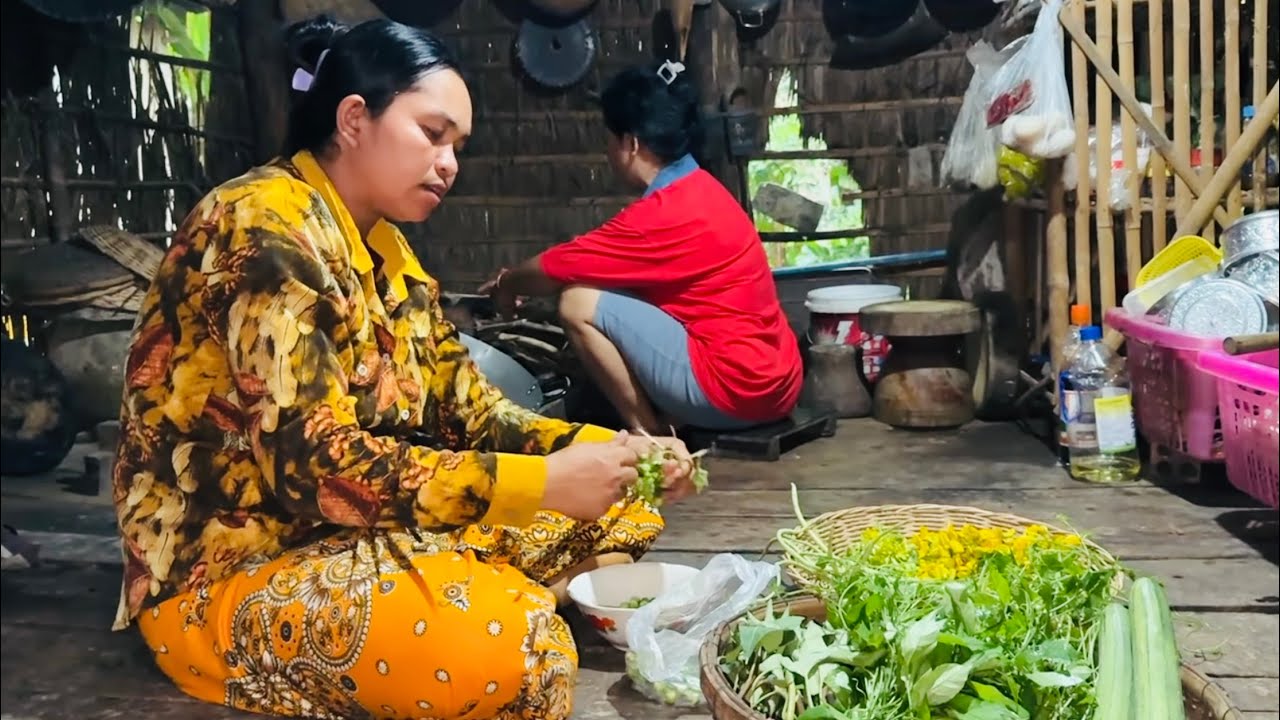 On a rainy day, my wife and sister prepare tuk kroeung for dinner
