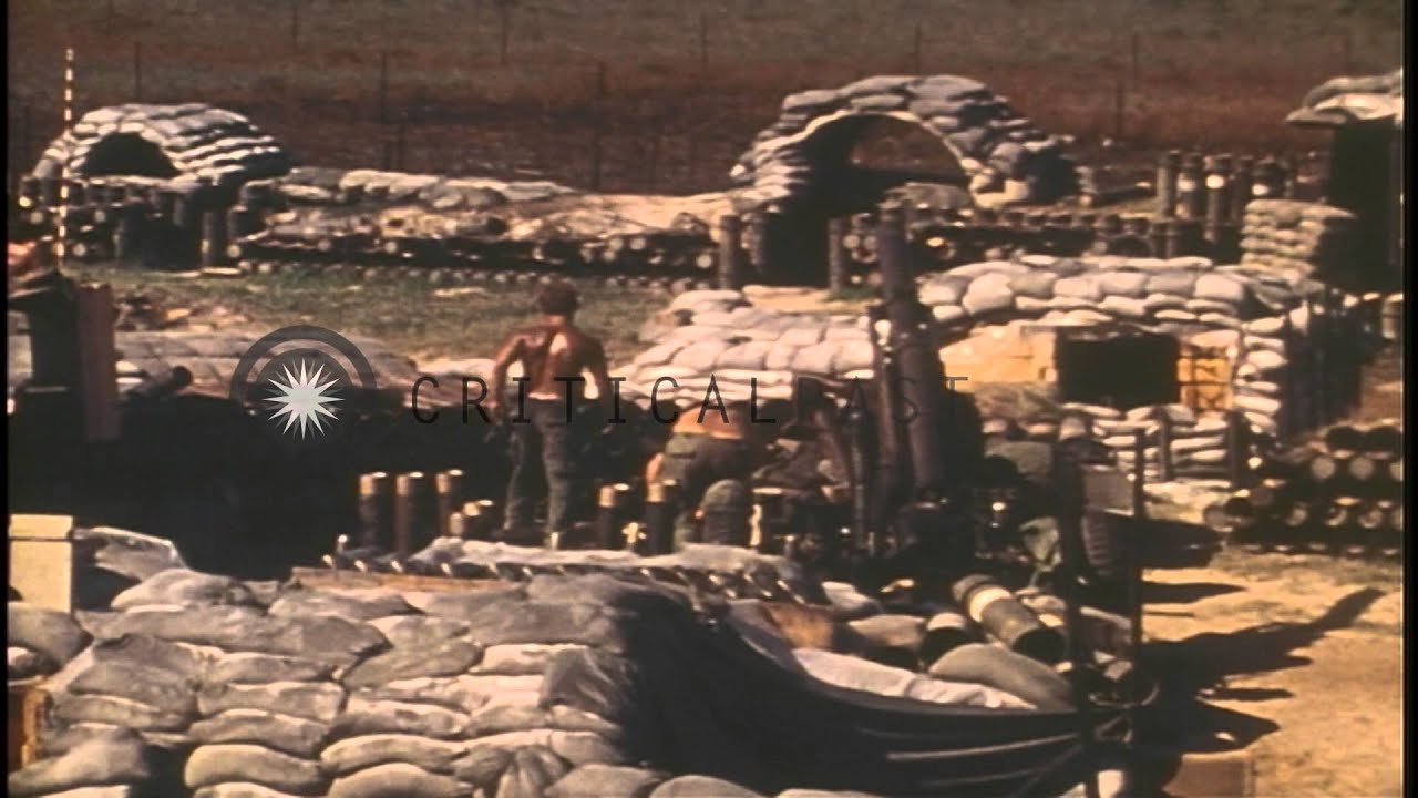 US soldiers of 82nd Artillery look through binoculars and prepare rounds for howi...HD Stock Footage