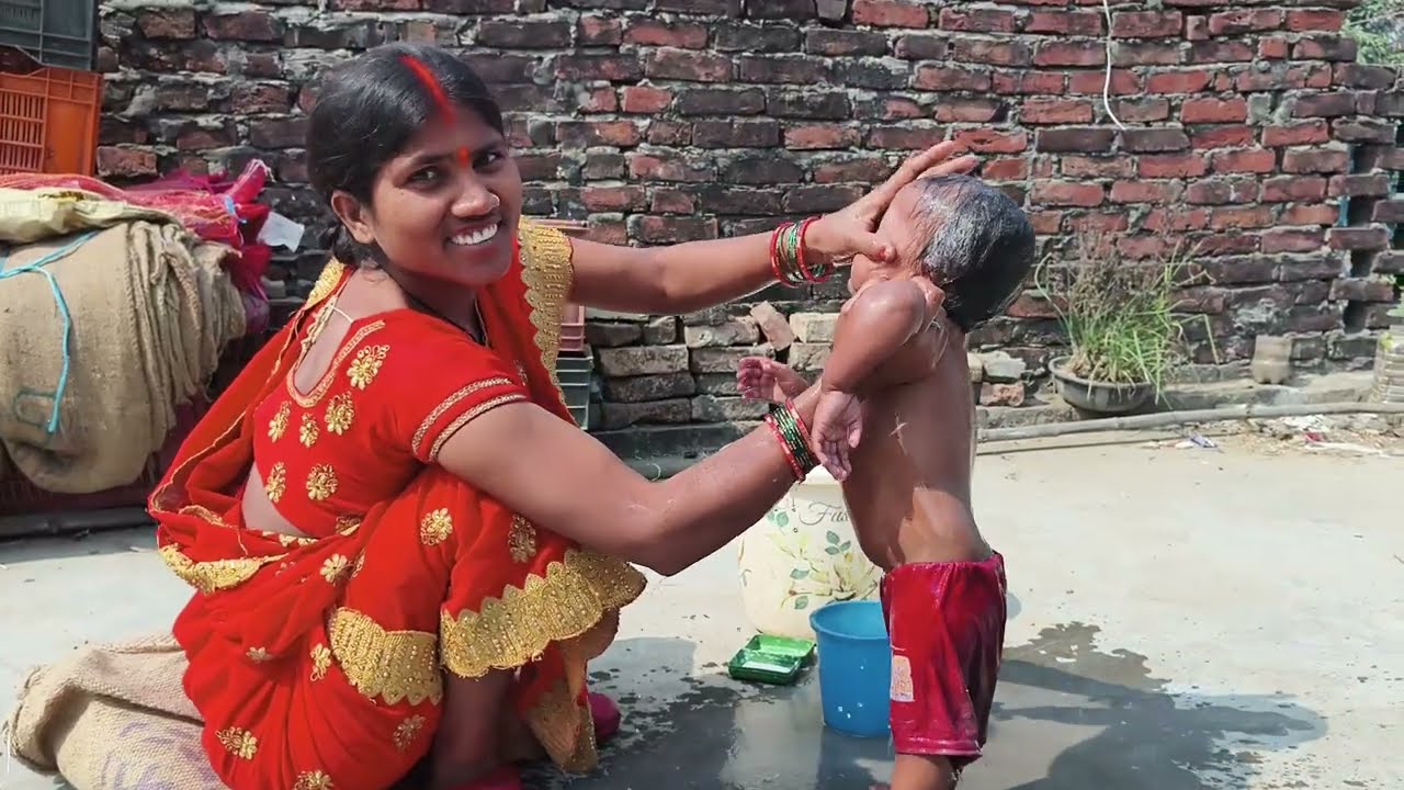baby bathing village style ||| newborn baby bathing in village