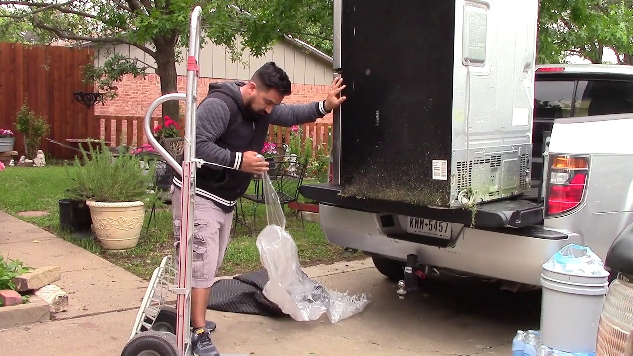 Loading a refrigerator by myself in my pickup truck