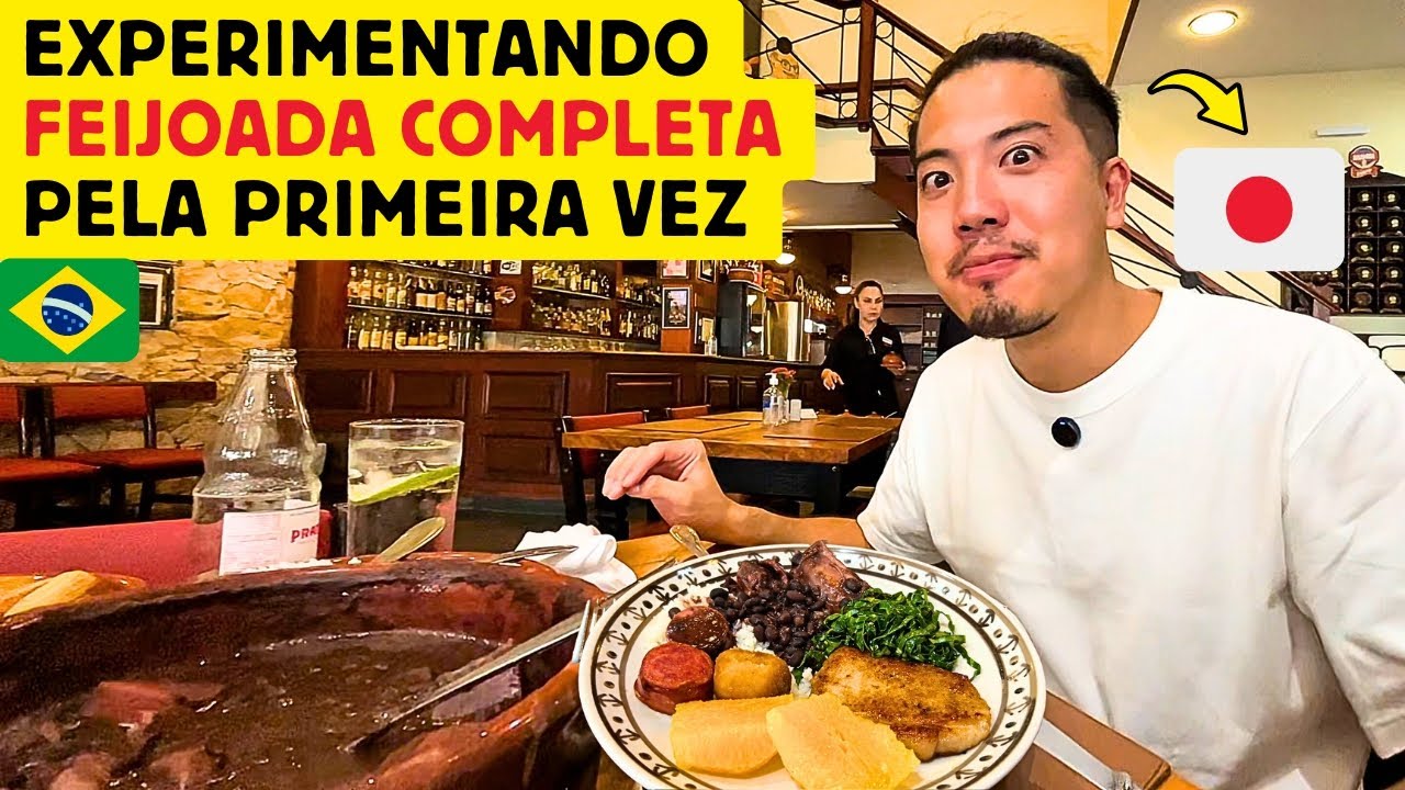 Um japonês experimentando feijoada completa pela primeira vez no Brasil