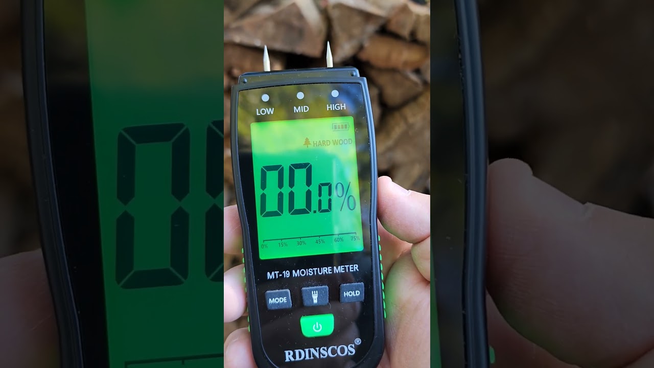 checking the moisture content of firewood #firewood #moisture