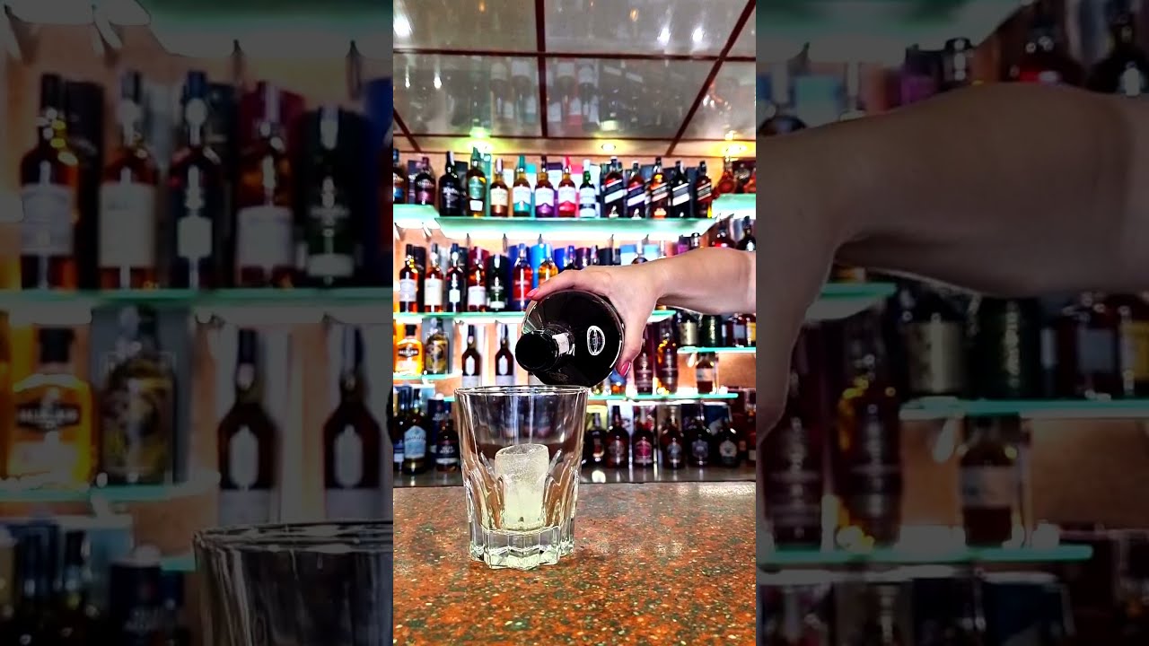 Pouring Merry's Irish Cream Liqueur 1.0L 17% Over Ice