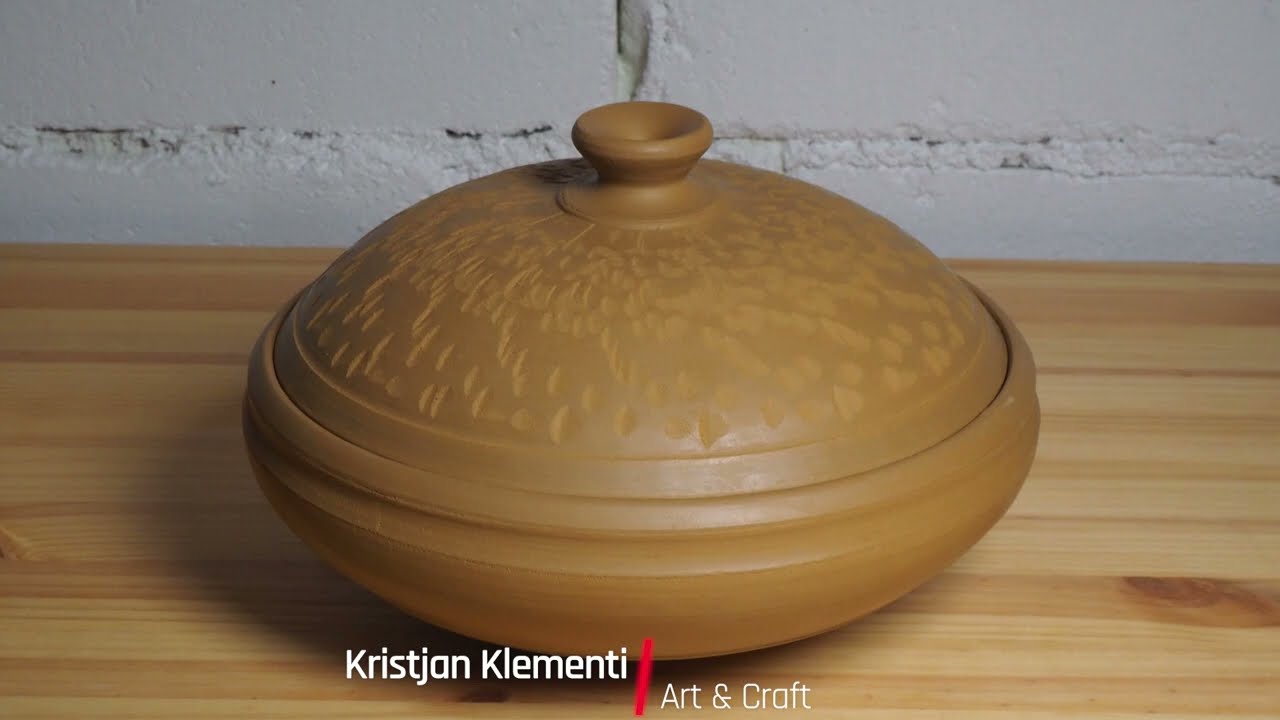 Throwing and trimming a wide and shallow lidded jar .