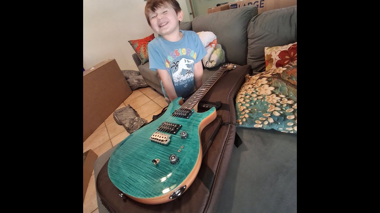 My son Danny Ramos & Son Neko with New Guitar