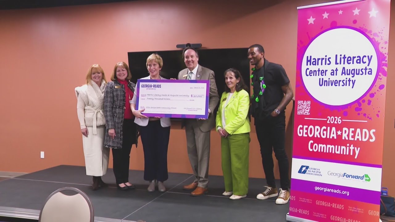 $20K check presented to Dr. Paulette P. Harris Literacy Center