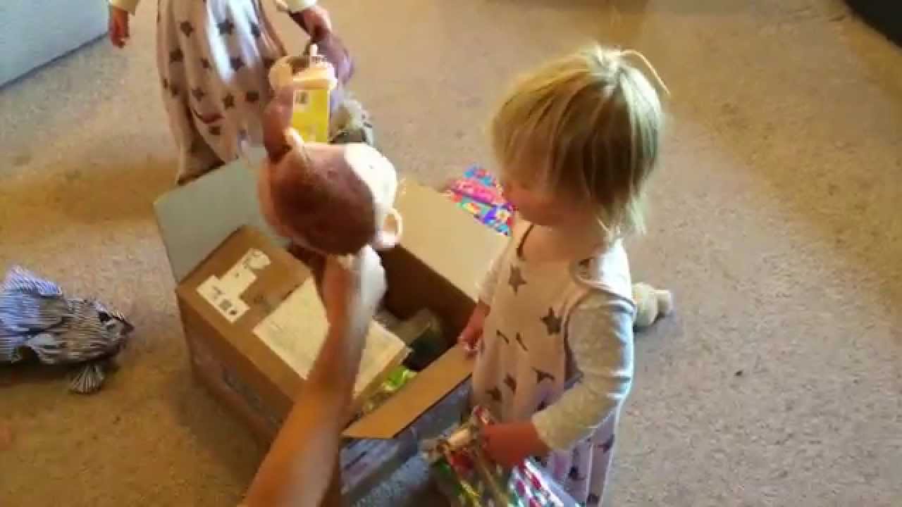 Twins opening presents on 2nd birthday.