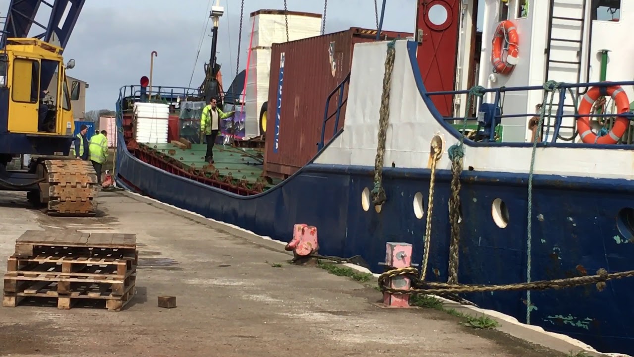 John Deere tractor being loaded onto the Silver River Ramsay