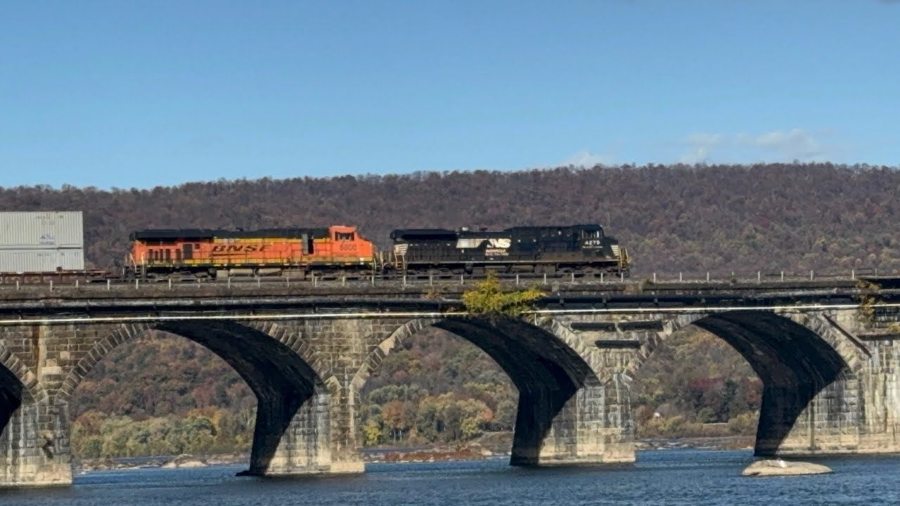 NS 4279 leads NS 26X over the Rockville bridge with a BNSF ES44AC trailing 10/26/2024