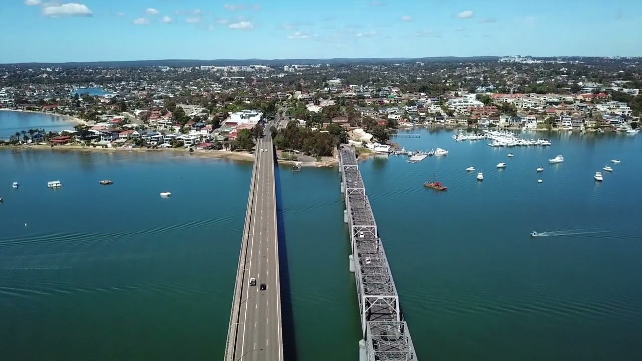 Drone tilting up over two bridges, Sydney Australia