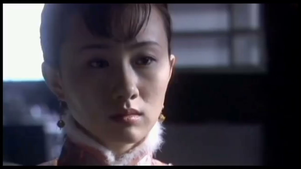 A boy removed a young lady's high heel shoes and her stocking