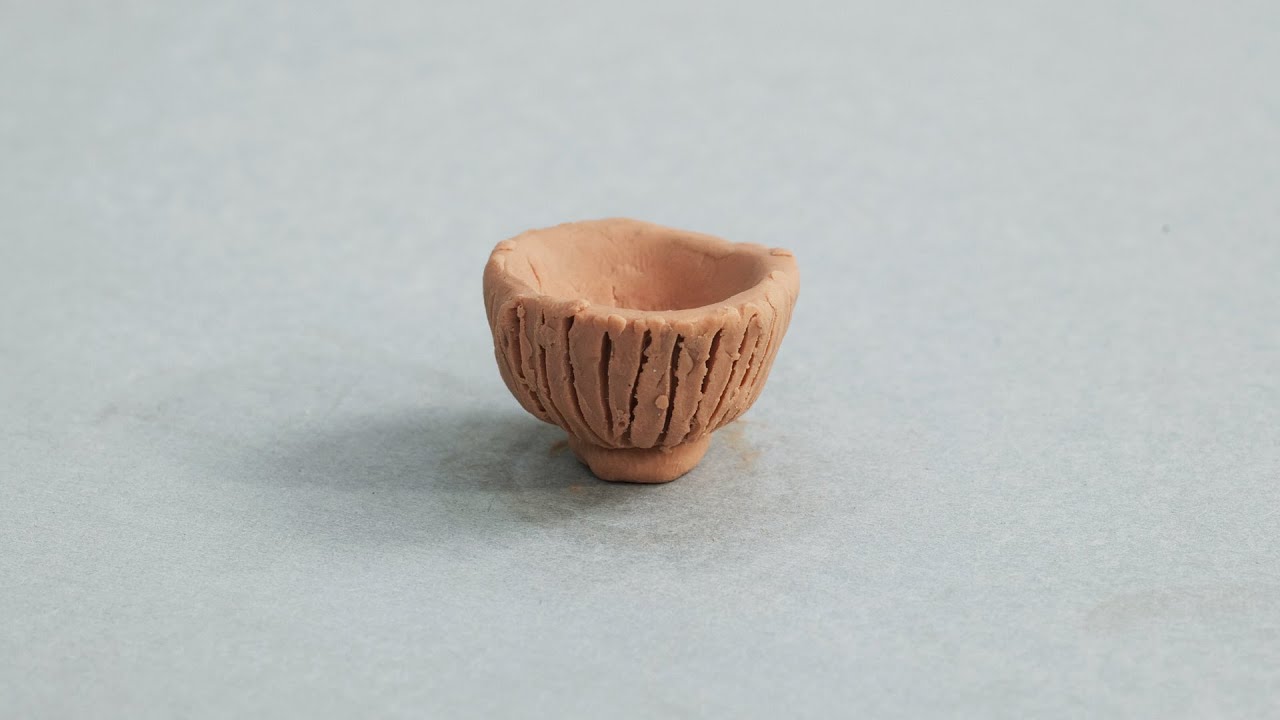 CLAY RECORDS - A rice bowl the size of a coin. NOT CERAMIC.