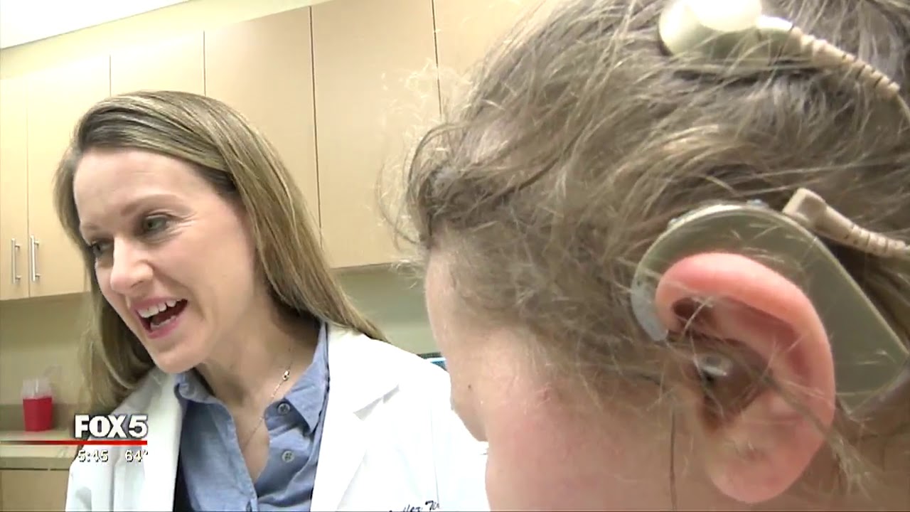 8 year old girl receives cochlear implant
