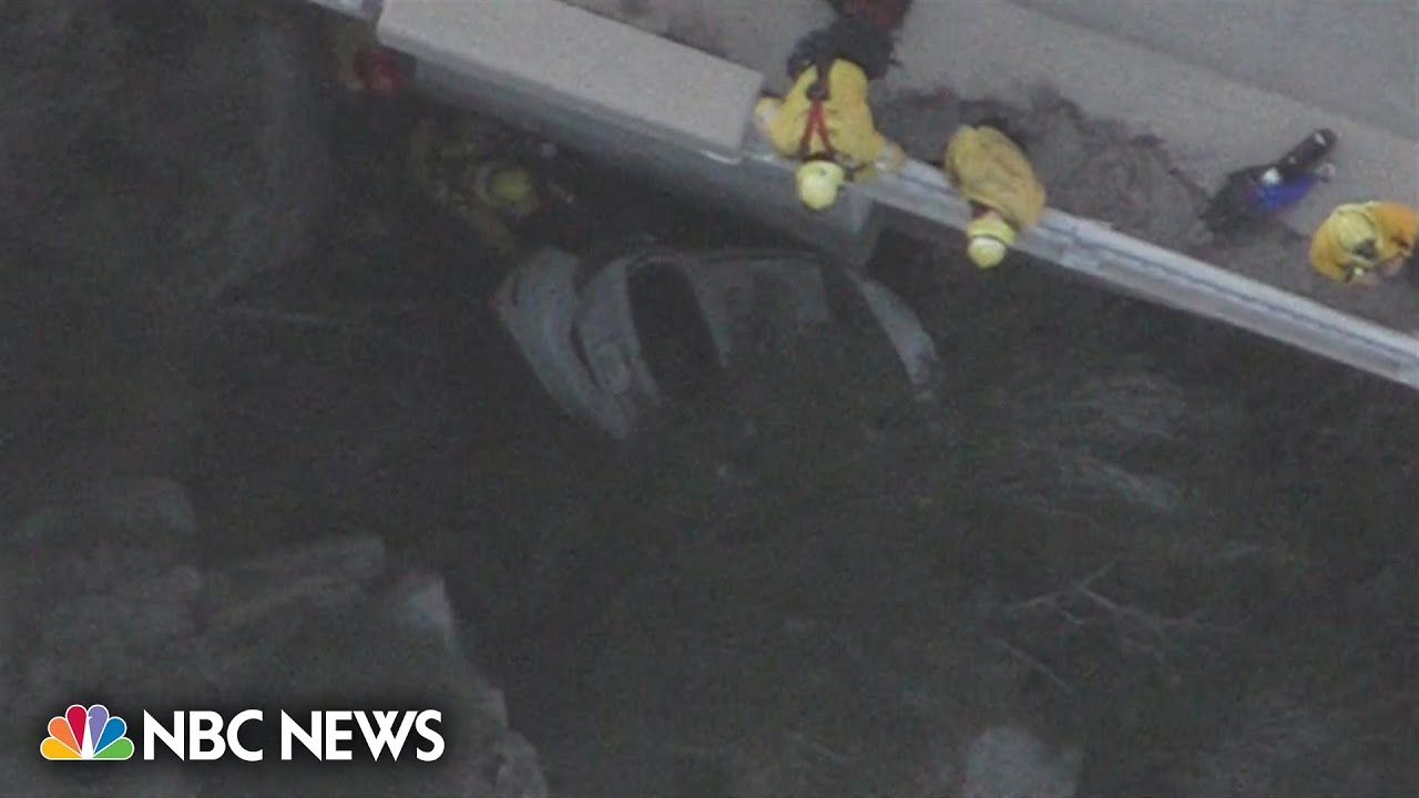 Rescue crews save driver from car 300 feet below bridge