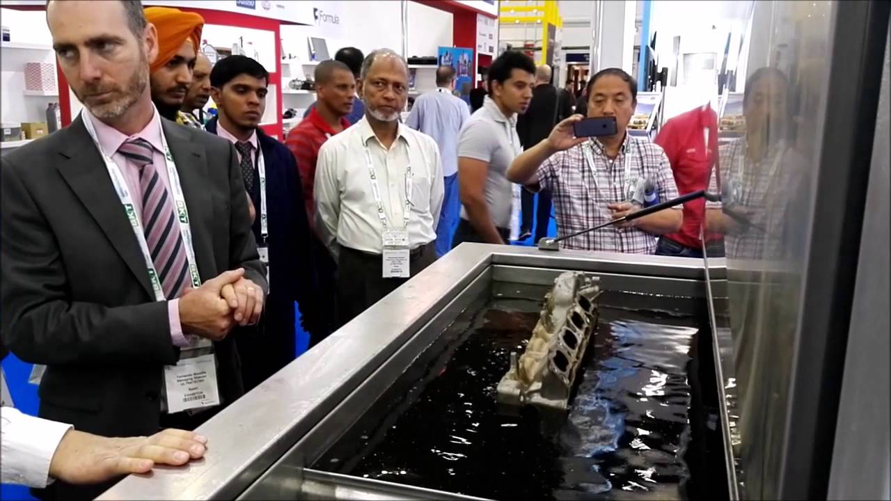 Ultrasonic cleaning demonstration of automotive parts during Automechanika Dubai 2016