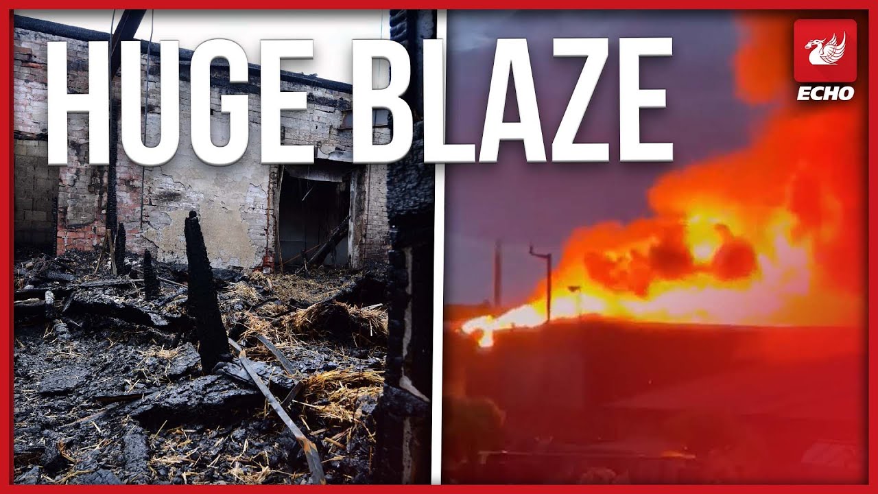 Huge warehouse fire rages into night as people told to keep windows closed