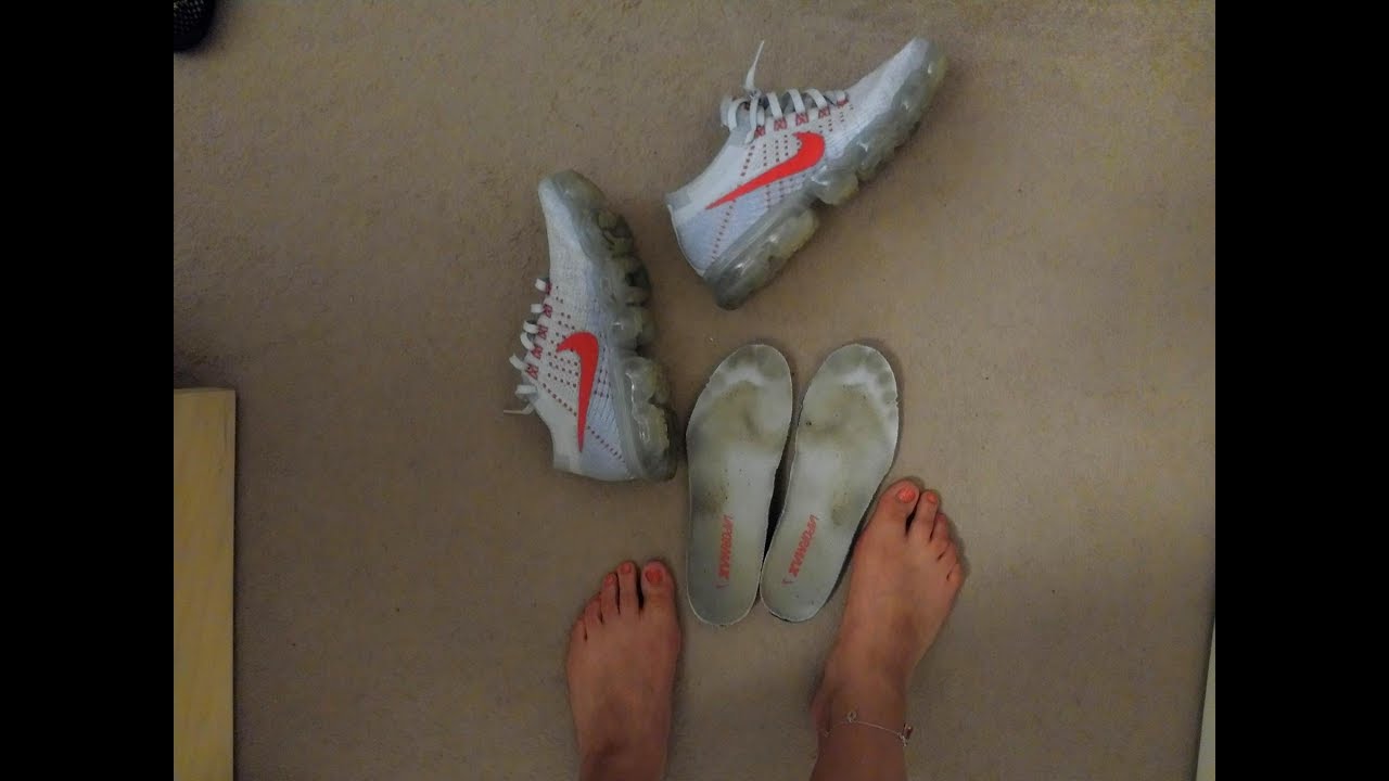 She is removing stinky Nike Vapormax
