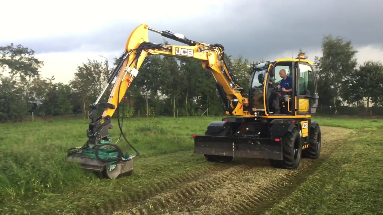 JCB Hydradig 110W met Hemos HK125 klepelbak