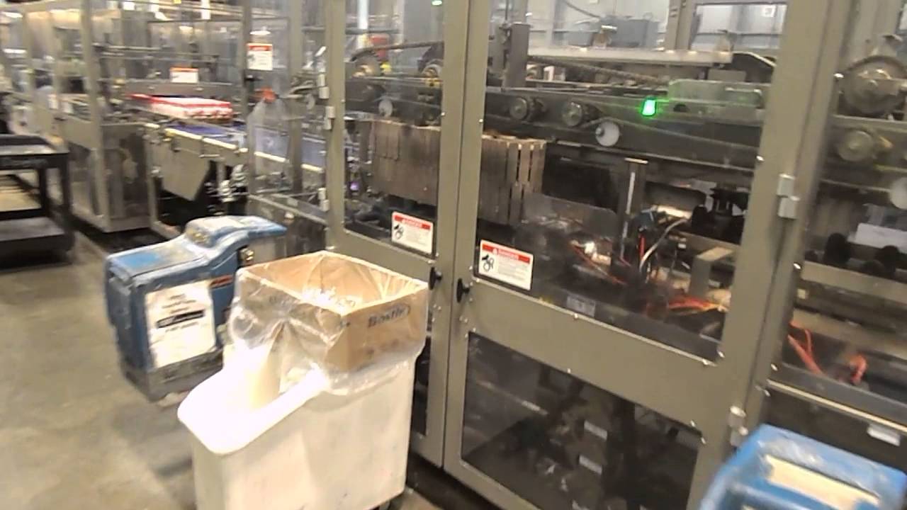 Douglas Continuous Motion Traypacker with Shrinkwrapper