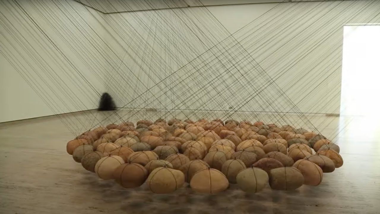 Artist Ken Unsworth installs his work 'Suspended Stone Circle II'