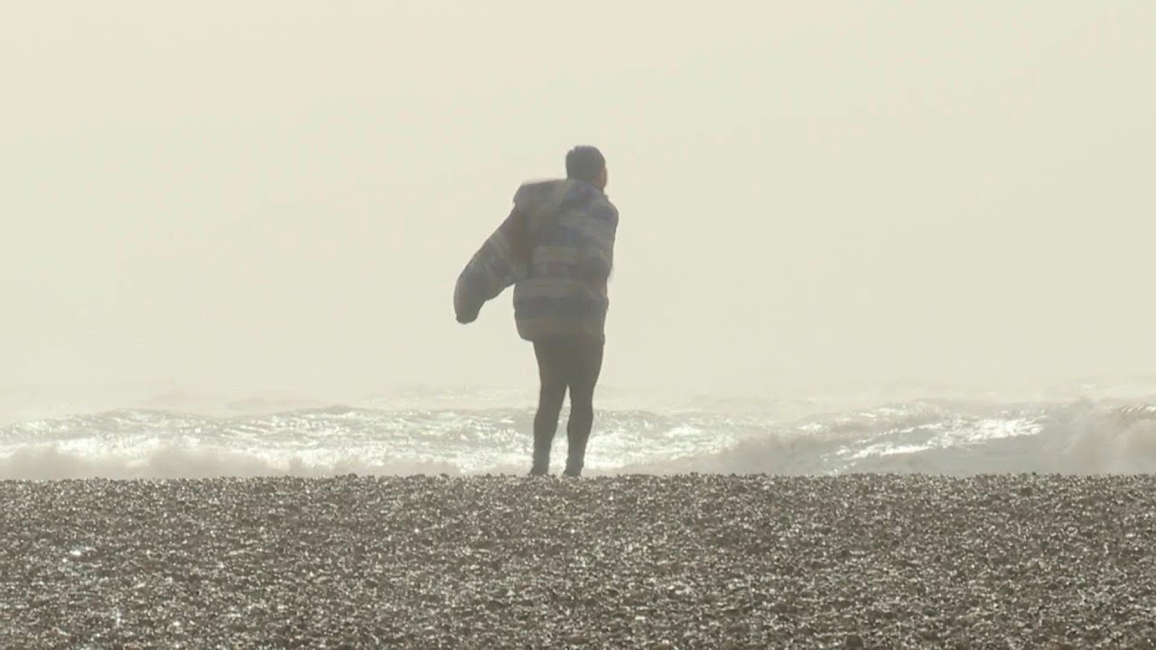 Beachgoers brave Brighton seafront despite Storm Eunice | AFP
