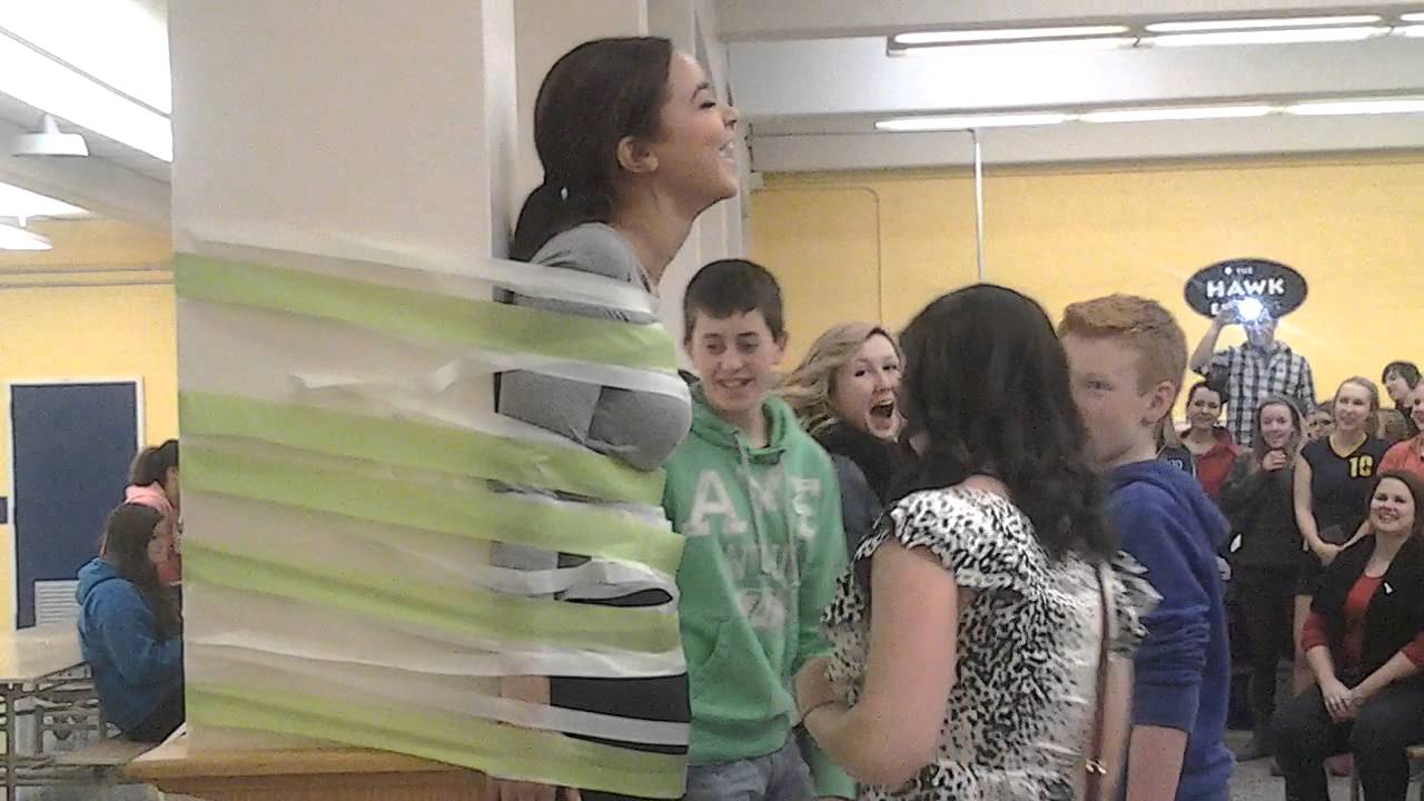 NDSS Taping Students Council to the wall.