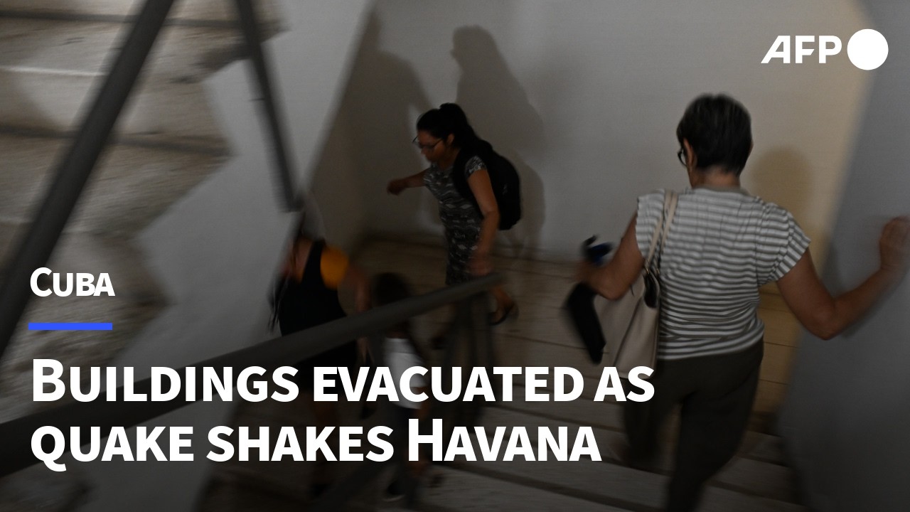 Workers evacuate building in Havana after earthquake rattles Cuba | AFP