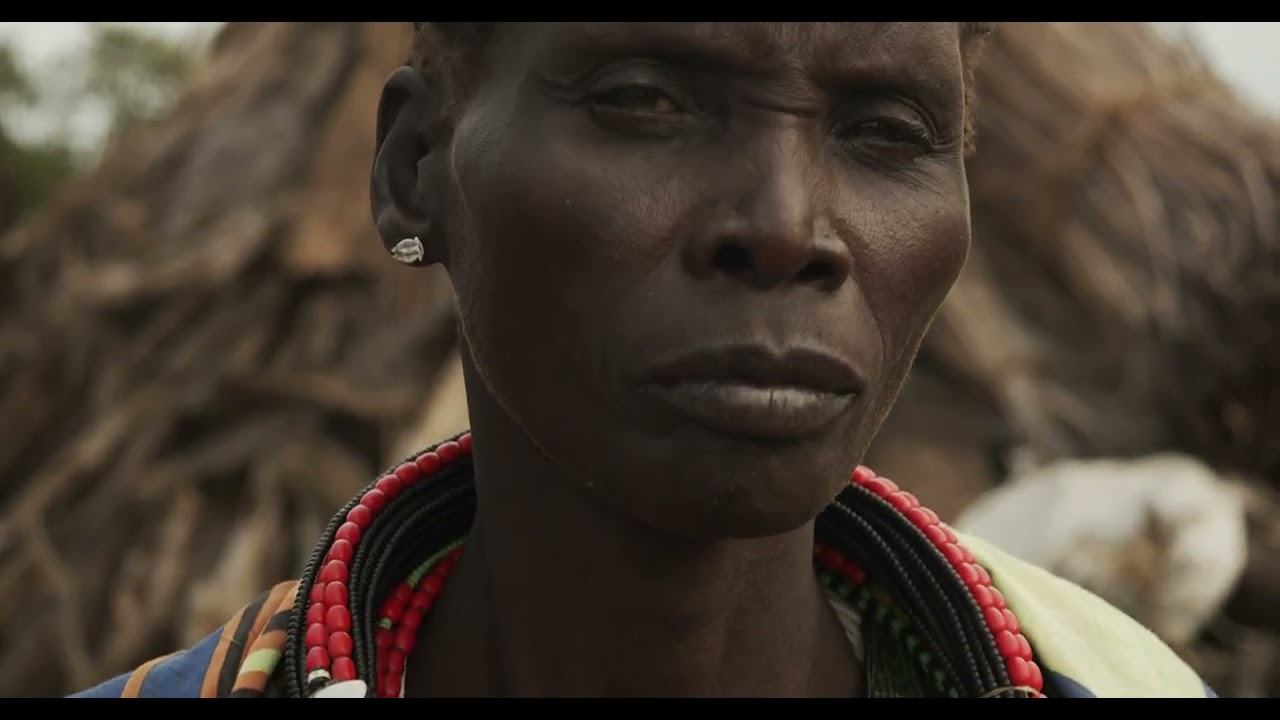Toposa tribe woman in traditional clothing in a village, Namorunyang State, Kapoeta, South Sudan