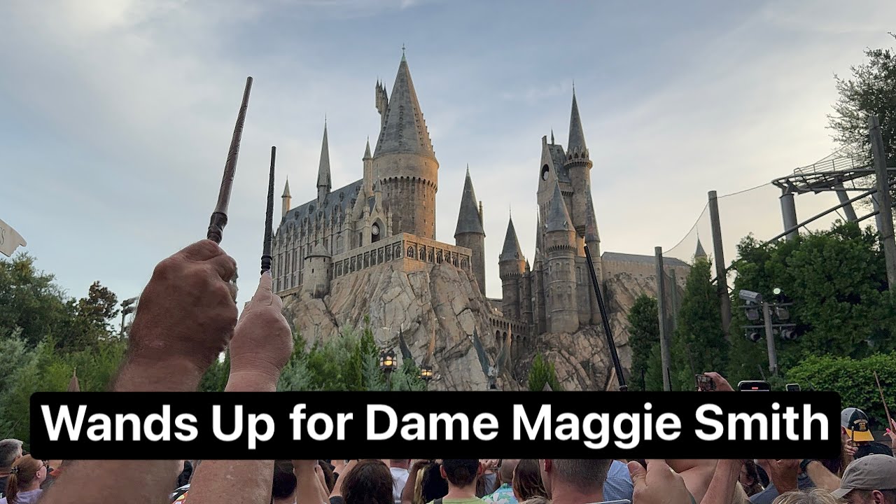 Fans Pay Tribute to Dame Maggie Smith with Wands Up in front of Hogwarts Castle at Universal Orlando
