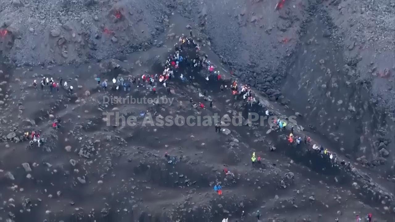 Eruptions on snowy Mt Etna prompt new restrictions and protests from tourism guides