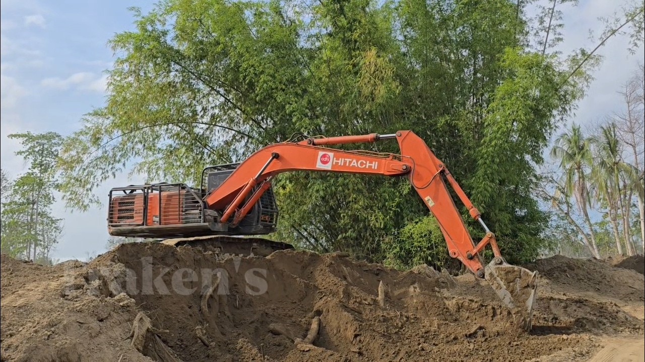 Sumitomo Excavator Hitachi Bulldozer and Dump Trucks Clearing and Landscaping River embankment.