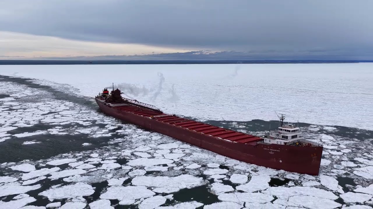 Lee A Tregurtha Captured by the ice and helped along by USCG Spar on her way to CN dock for pellets