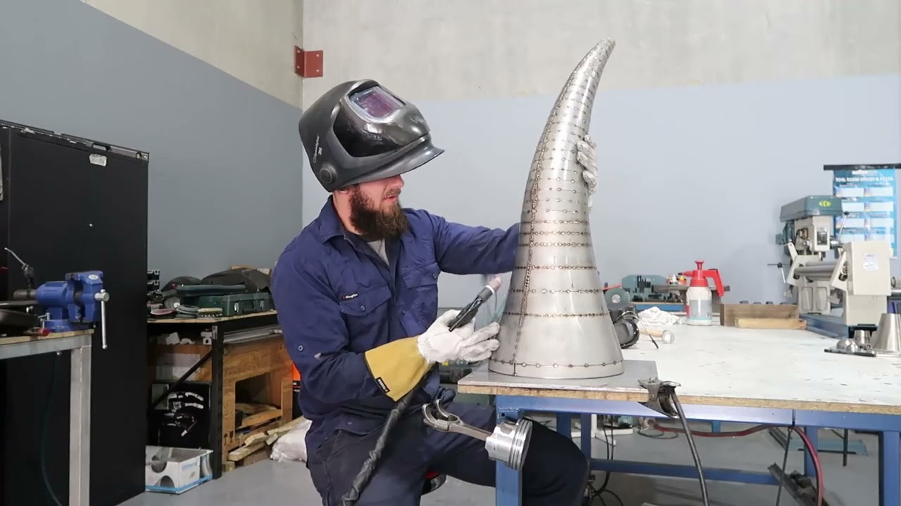 Creating mirror polished stainless steel Rhino horns.. Rhino sculpture 