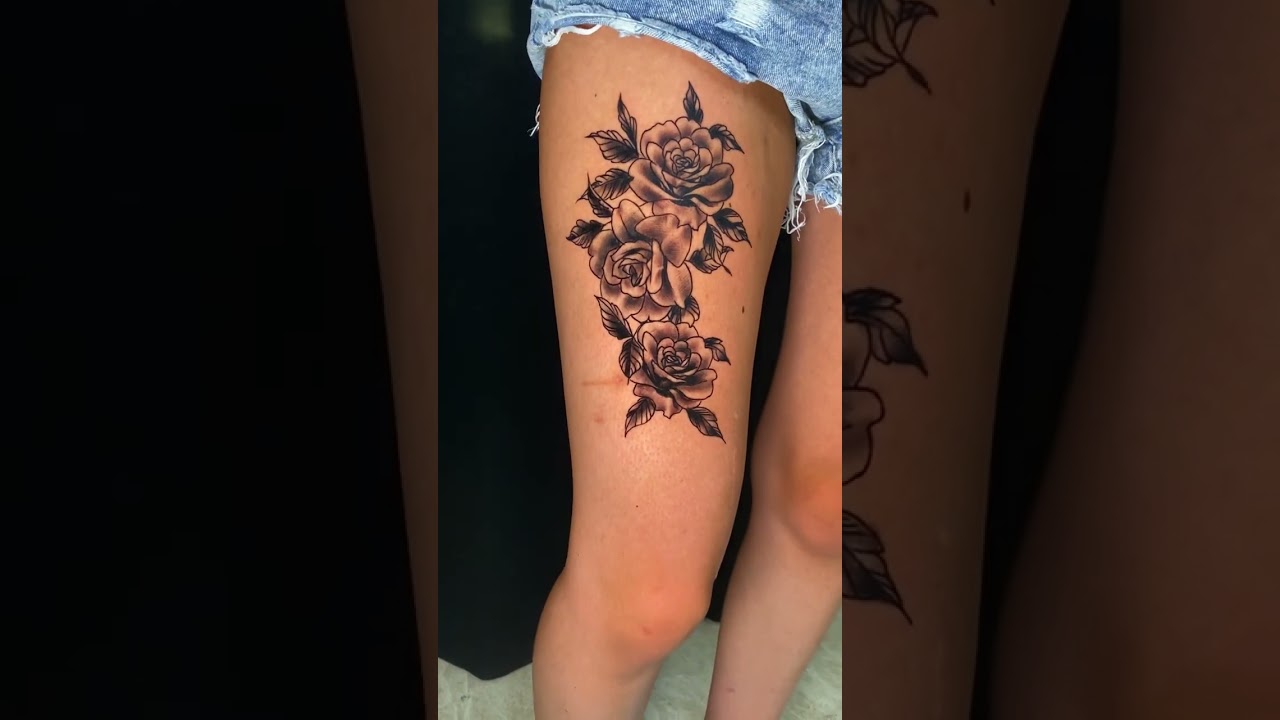 3 rose tattoed on woman thigh - 