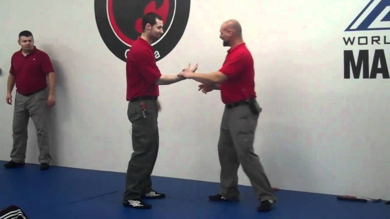 EDGED WEAPON DEFENSE WITH A WRIST LOCK