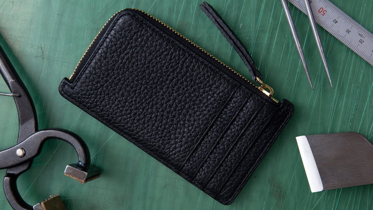 The process of making a mini leather wallet. [ leather working ]