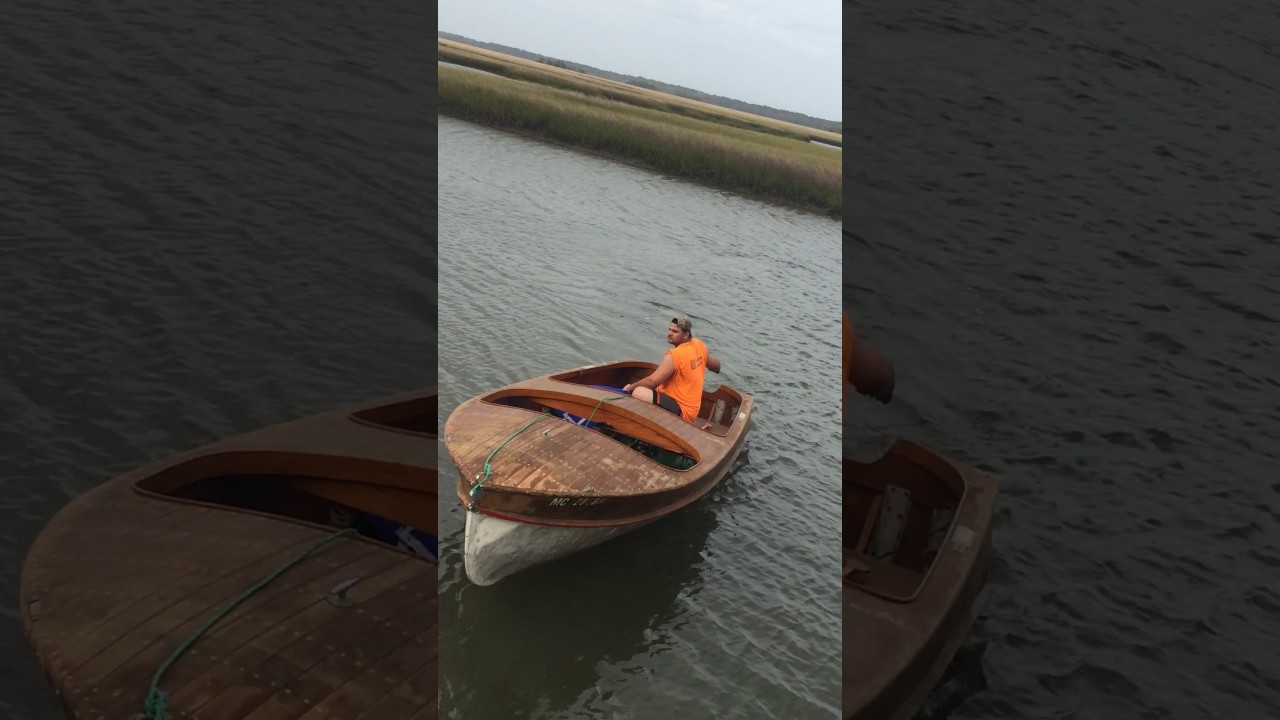 Pre- Restoration launch of a 1950 Wagemaker Wolverine wood boat .