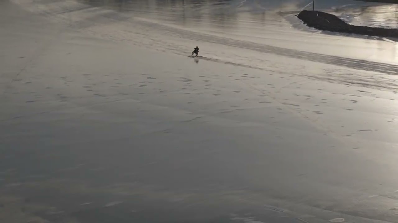 An artistic ice design was done by this guy on his bike on the ice of Lake Winnebago, WI.