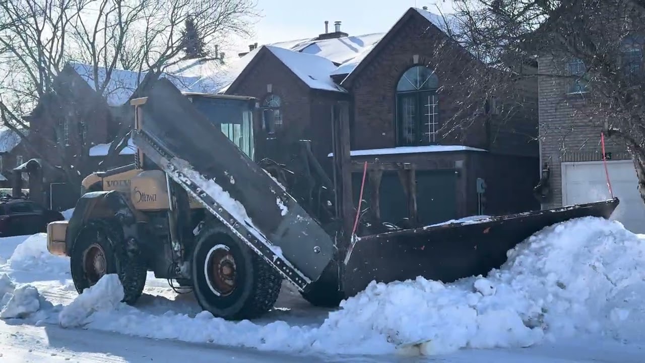 Snow removal operation on Shaughnessy crescent in Kanata north 