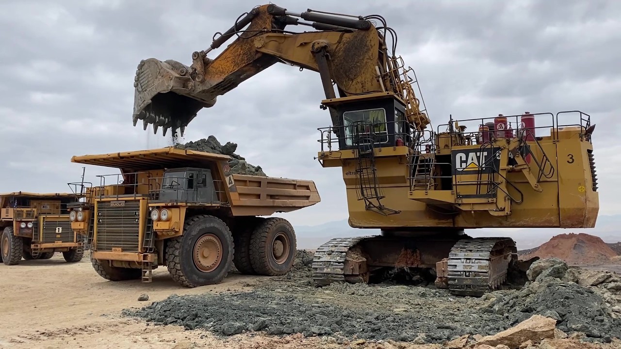 Huge Caterpillar 6040 Mining Excavator Loading Hitachi EH3500 Dumpers - Operator View
