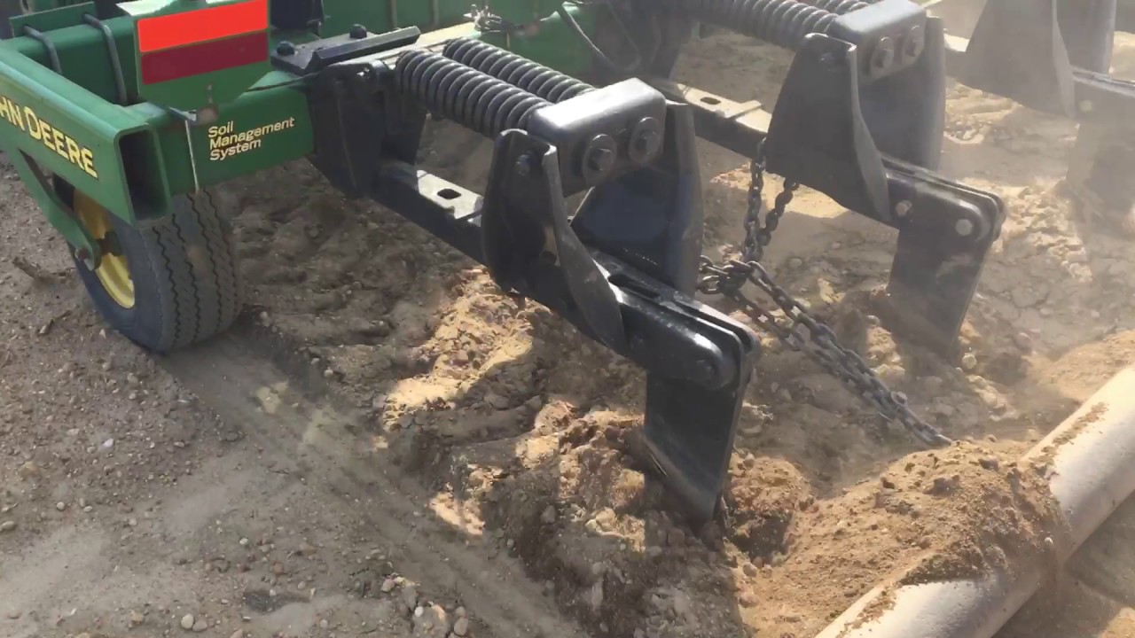 Case 225 Tractor pulling 5 Shank John Deere Subsoiler through hard ground