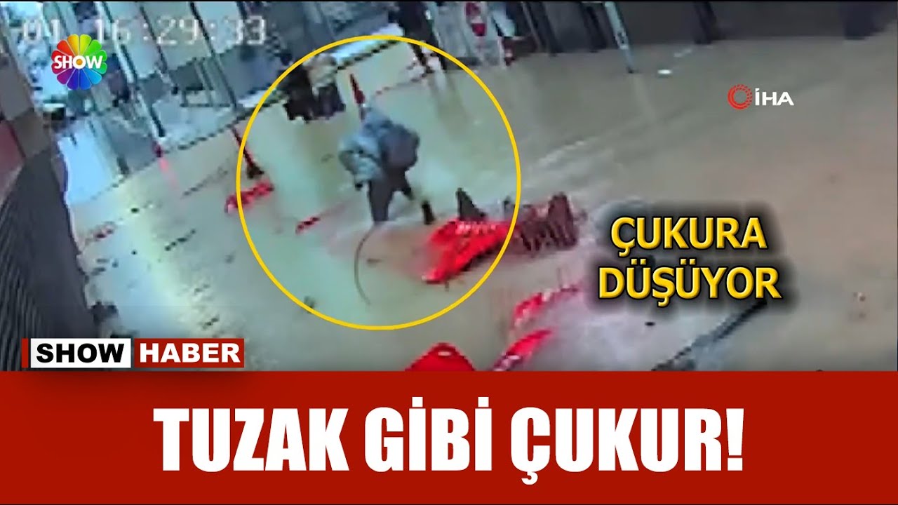 Göle dönen sokakta çukura düştü